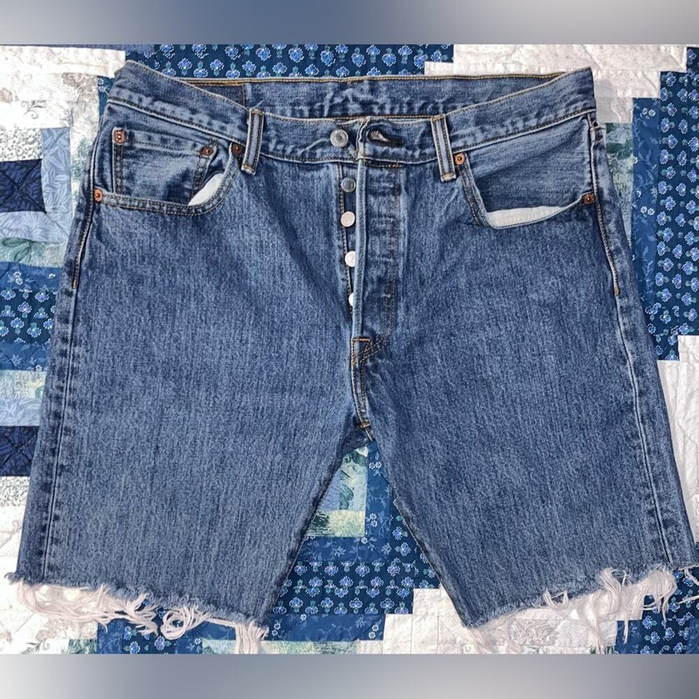Vintage Levi's 501 cut-off denim shorts with a button fly and frayed hem